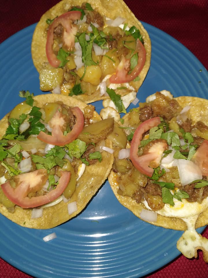 Papas with chorizo and egg tostada