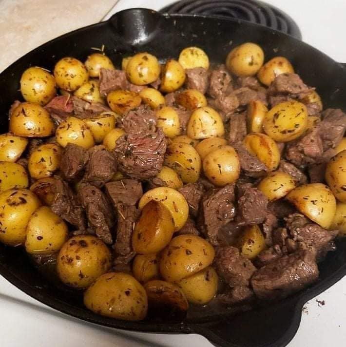 Beef steak with butter and potatoes
